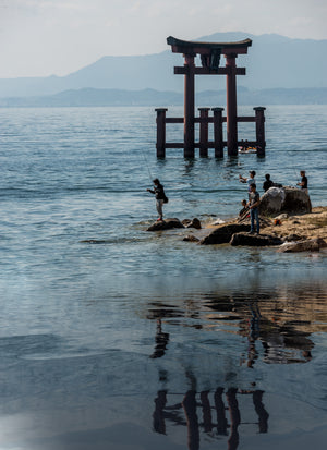 Japanese fishermen reflection on the lake